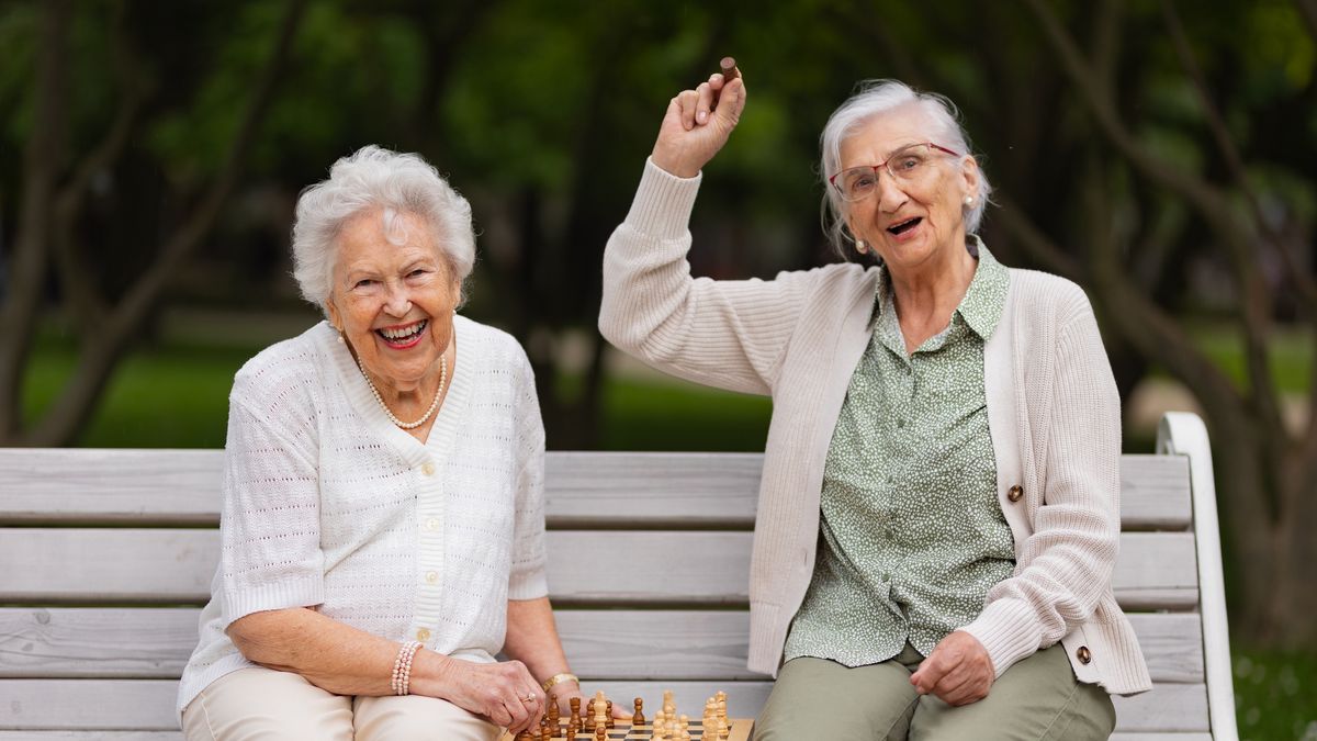 Elderly best friends playing chess in public park, having fun together.
Elderly best friends playing chess in public park, sitting on the park bench. Senior women enjoying free time, having fun together. Two female residents playing chess in nursing home garden. Concept of friendship and free time activities in retirement.
Halfpoint Images