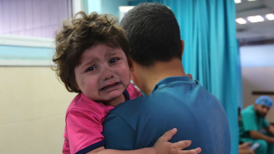 GAZA CITY, GAZA - MAY 11: A wounded Palestinian girl is being brought to receive medical treatment at Al-Shifa Hospital after Israeli airstrikes hit various parts of Gaza Strip, in Gaza City, Gaza on May 11, 2021. (Photo by Ashraf Amra/Anadolu Agency via Getty Images)