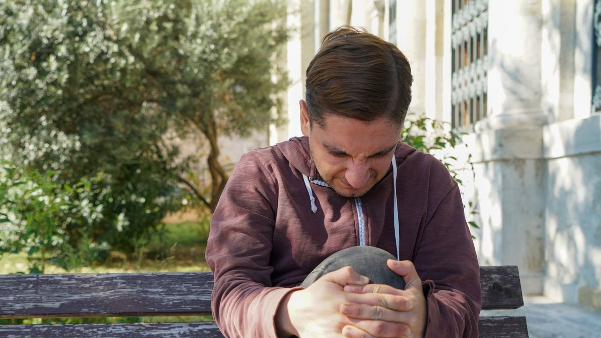 A close-up shot of a young white man holding his knee in pain
A close-up shot of a young white man holding his knee in pain
Alican Lazutti
