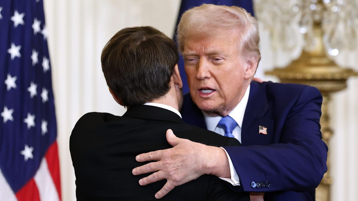 WASHINGTON, DC - FEBRUARY 24: U.S. President Donald Trump and French President Emmanuel Macron embrace at the conclusio of a joint news conference in the East Room of the White House on February 24, 2025 in Washington, DC. Macron is meeting with Trump in Washington on the third anniversary of Russia's full-scale military invasion of Ukraine. (Photo by Chip Somodevilla/Getty Images)