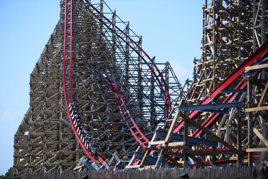 Zadra, the world's tallest wooden roller coaster in PolandZATOR, POLAND - AUGUST 29: People ride on  the world's tallest wooden roller coaster, Zadra at Energylandia, Zator, Poland on August 29, 2019. Wooden Coaster Zadra reaches hight of 61 m and a speed of 121 km/h during a length of 1316 m. In a train wagon for 24, visitors may expect a 90 degrees slope, 3 inversions, unexpected gravitational effects among other surprises. (Photo by Omar Marques/Anadolu Agency via Getty Images)Anadoluzator, zadra, world's tallest wooden roller coaster