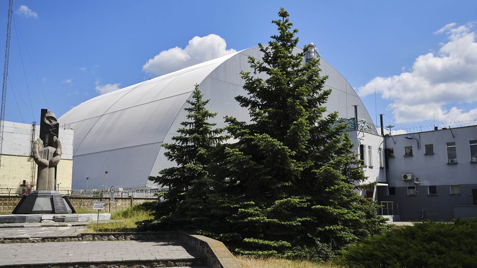 CHERNOBYL, UKRAINE - 2022/06/03: New sarcophagus covering the stricken reactor. After Russian troops left Chernobyl, the Ukrainian army has taken control of the site. Radiation levels rose due to earthworks in places such as the well-known Red Forest, where Russian troops dug trenches. Ukraine is not only facing an invader in Chernobyl, it must also fight an invisible enemy, radiation. (Photo by Raul Moreno/SOPA Images/LightRocket via Getty Images)