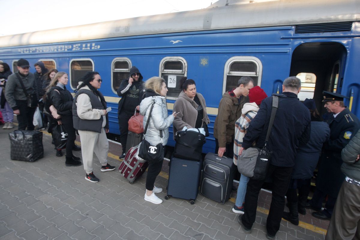 Ukrainian refugees board the train to Przemysl (Poland), amid Russia's invasion of Ukraine, in Odesa, Ukraine 28 March 2022. (Photo by STR/NurPhoto via Getty Images)