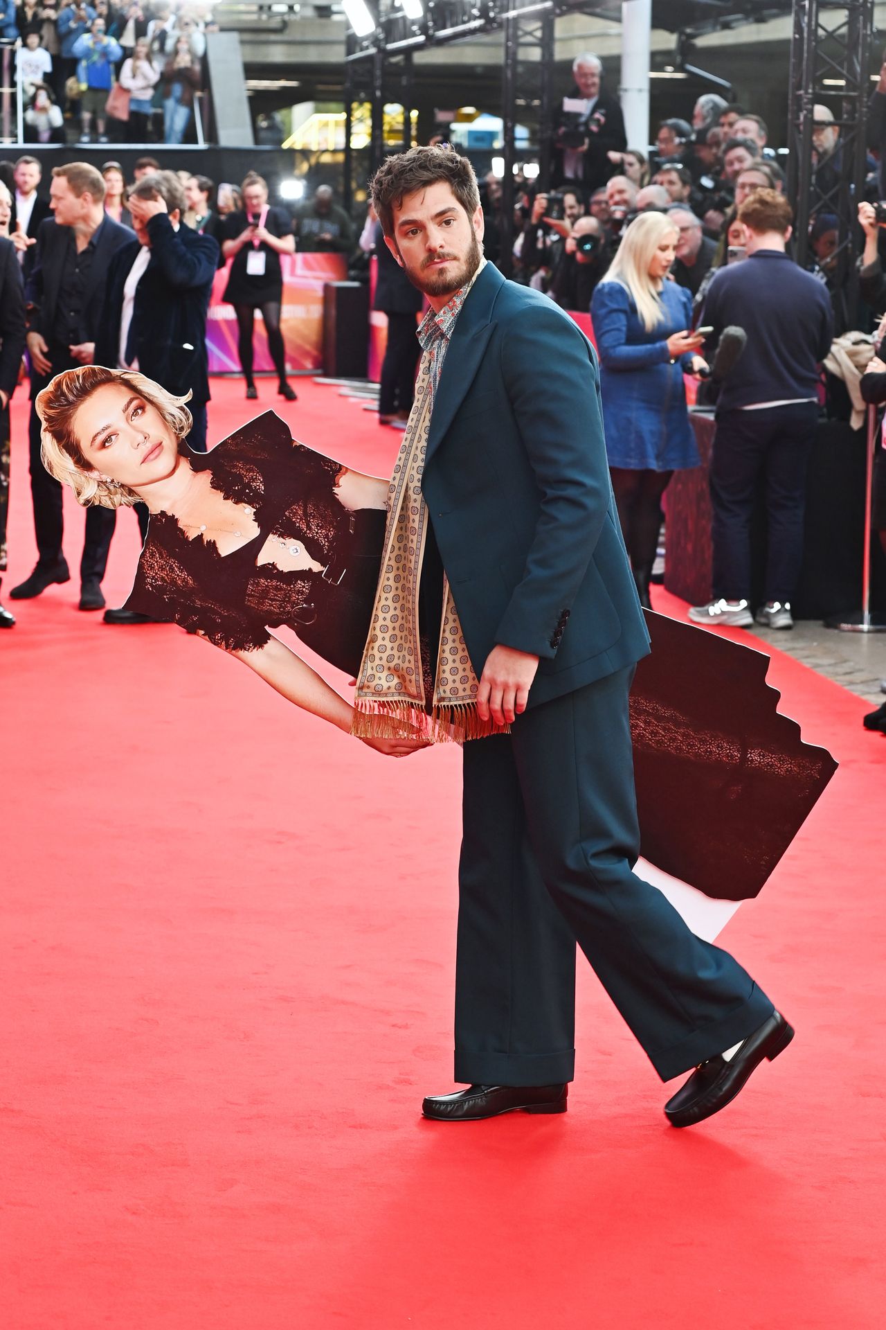 LONDON, ENGLAND - OCTOBER 17: Andrew Garfield (R) poses with a cardboard cutout of Florence Pugh at the Headline Gala screening of "We Live In Time" during the 68th BFI London Film Festival at The Royal Festival Hall on October 16, 2024 in London, England. (Photo by Alan Chapman/Dave Benett/WireImage)