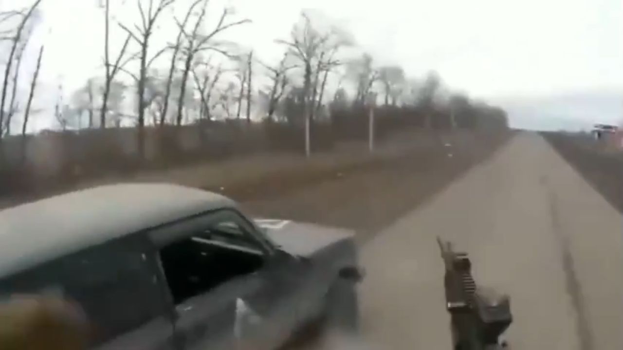 A Ukrainian soldier just before shooting down a Russian drone.