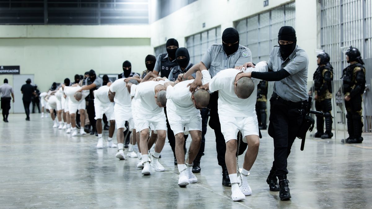 TECOLUCA, EL SALVADOR - MARCH 16: In this handout photo provided by the Salvadoran government,  guards escort the inmates allegedly linked to criminal organizations at CECOT on March 16, 2025 in Tecoluca, El Salvador. Trump's administration deported 238 alleged members of the Venezuelan criminal organizations 'Tren De Aragua' and Mara Salvatrucha with only 23 being members of the Mara. Nayib Bukele president of El Salvador announced that his government will receive the alleged members of the gang to be taken to CECOT. On February of 2023 El Salvador inaugurated Latin America's largest prison as part of President Nayib Bukele's plan to fight gangs. (Photo by Salvadoran Government via Getty Images)