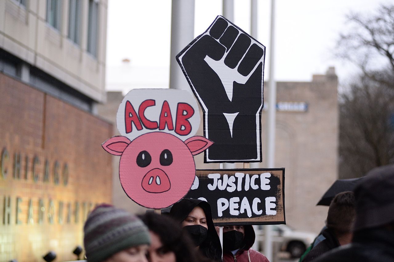 CHICAGO, UNITED STATES - APRIL 18: Protesters hold signs outside Chicago police headquarters, joining Dexter Reed's demonstration against police brutality and discrimination in Chicago, Illinois on April 18, 2024. Dexter Reed was killed on March 21, 2024 by Chicago police in Humboldt Park after a traffic stop for an alleged seatbelt violation. (Photo by Jacek Boczarski/Anadolu via Getty Images)