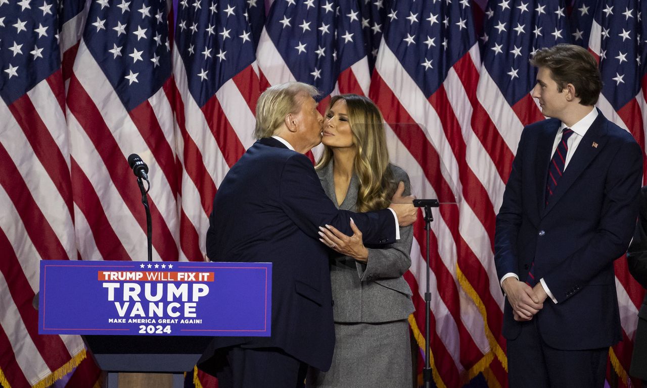 Republican presidential nominee former President Donald Trump kisses his wife, Melania Trump, during his election night party at the Palm Beach County Convention Center on Tuesday, Nov. 5, 2024, in West Palm Beach, Florida. (Matias J. Ocner/Miami Herald/Tribune News Service via Getty Images)