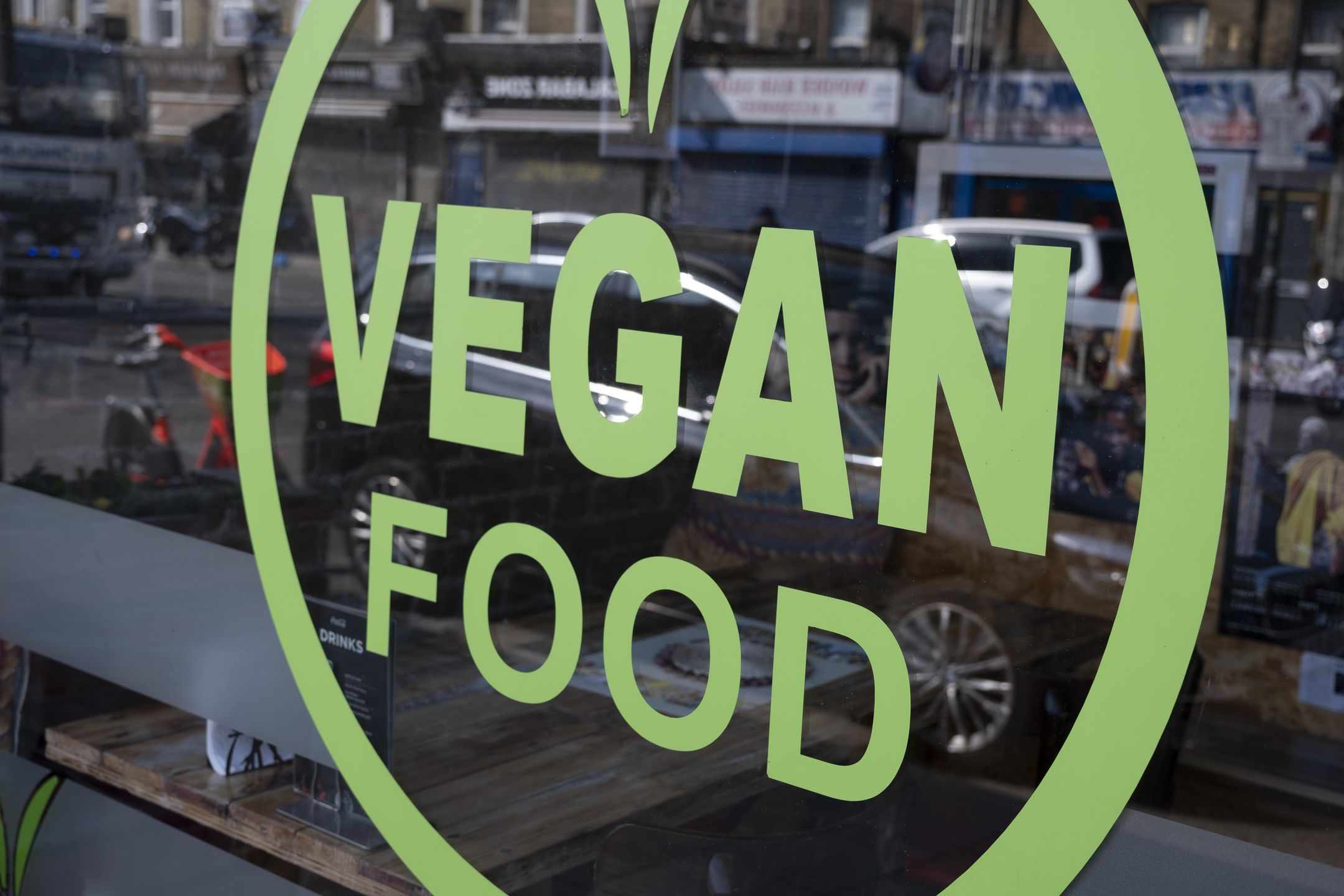 Vegan Food In LondonSign for vegan food in the window of a cafe on Old Kent Road on 24th March 2022 in London, United Kingdom. Veganism is the practice of abstaining from the use of animal products, particularly in diet, and an associated philosophy that rejects the commodity status of animals. (photo by Mike Kemp/In Pictures via Getty Images)Mike Kemplondon, english, britain, british, united kingdom, urban, outisde, go vegan, vegan, lifestyle, diet, health