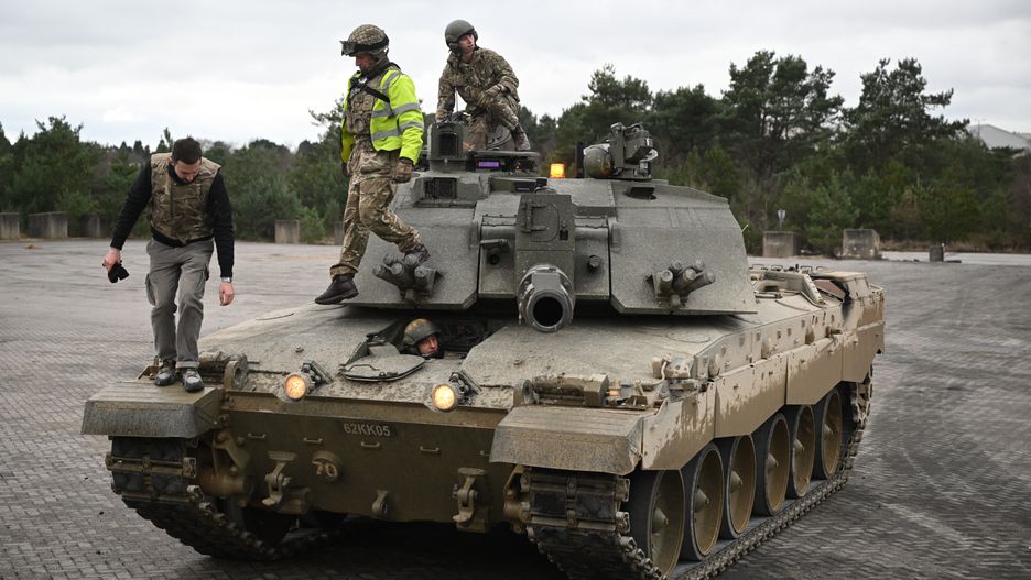 UNSPECIFIED, ENGLAND - FEBRUARY 23: Ukrainian army volunteers are trained on a Challenger 2 Tank at a military base on February 23, 2023 in Southern England.  The UK will send 14 Challenger 2 tanks to Ukraine marking the first time a Western country has sent its most powerful heavy armour to Kyiv to aid Ukrainians in the fight against the Russian Invasion. A thousand UK service personnel are deploying to run a training programme giving 10,000 volunteer recruits from Ukraine, with little to no military experience, the skills to be effective in frontline combat. Based on the UK's basic soldier training, the course covers weapons handling, battlefield first aid, fieldcraft, patrol tactics and the Law of Armed Conflict. (Photo by Leon Neal/Getty Images)