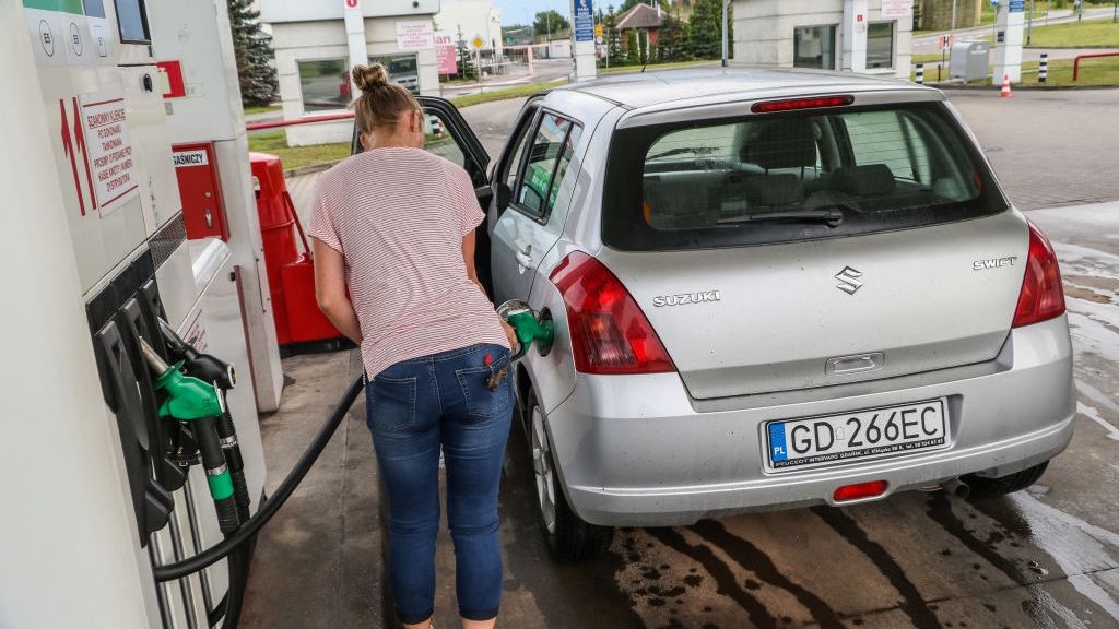 Fuel Won't Be Cheaper In Poland
Woman filling a silver Suzuki Swift car with petrol at a Auchan gas station is seen in Gdansk, Poland on 21 July 2019 According to forecasts of the fuel market analysts in Poland, a potential conflict with Iran in the face of oil will cause fuel price hikes at gas stations. There is currently no chance for prices below 5 zlotys per liter of gas, forecasted at the beginning of holidays. (Photo by Michal Fludra/NurPhoto via Getty Images)
NurPhoto
gdanmsk, fuel, fuel station, petrol station, benzine, diesel, fill up, filling up, fueling, refuelling, tank up, bunker, refuel, pump