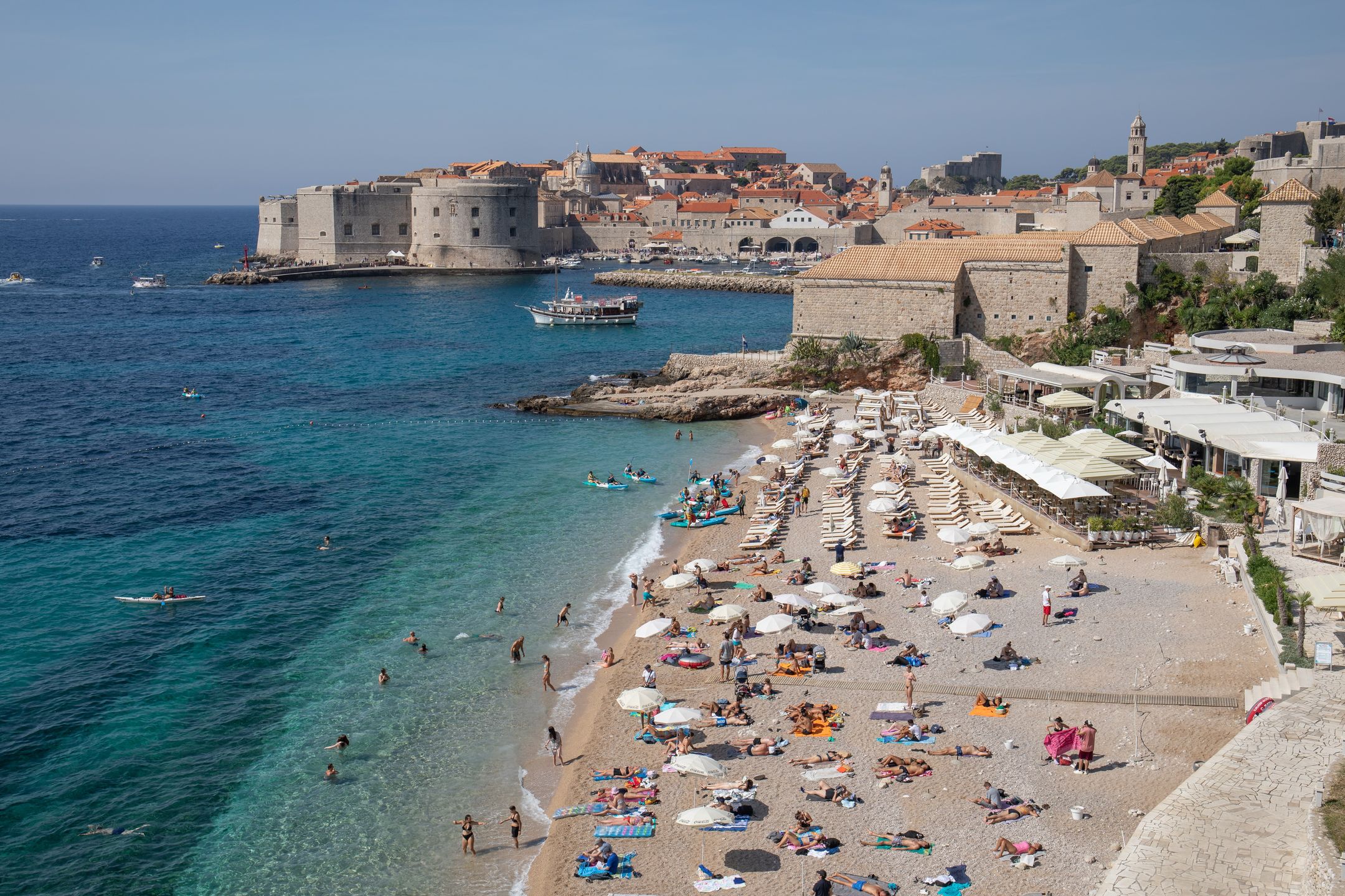 People enjoying the beach at Banje beach at the end of summer season in Dubrovnik, Croatia on September 13, 2023. (Photo: Grgo Jelavic/PIXSELL/DeFodi Images News via Getty Images)