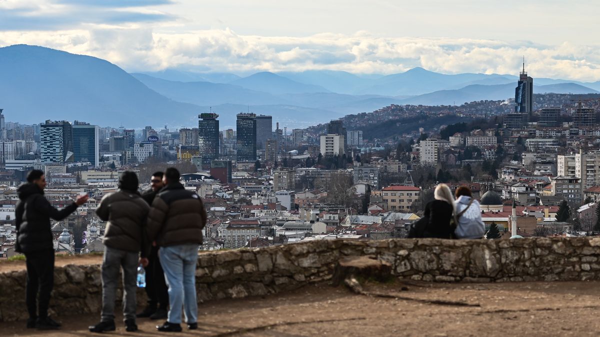 People gather at the Yellow Fortress viewpoint in Sarajevo, Bosnia and Herzegovina, on February 13, 2025. This year marks the 30th anniversary of the end of the war; the 30th anniversary of the end of the siege of Sarajevo is celebrated in February 2026. (Photo by Adrien Fillon/NurPhoto via Getty Images)