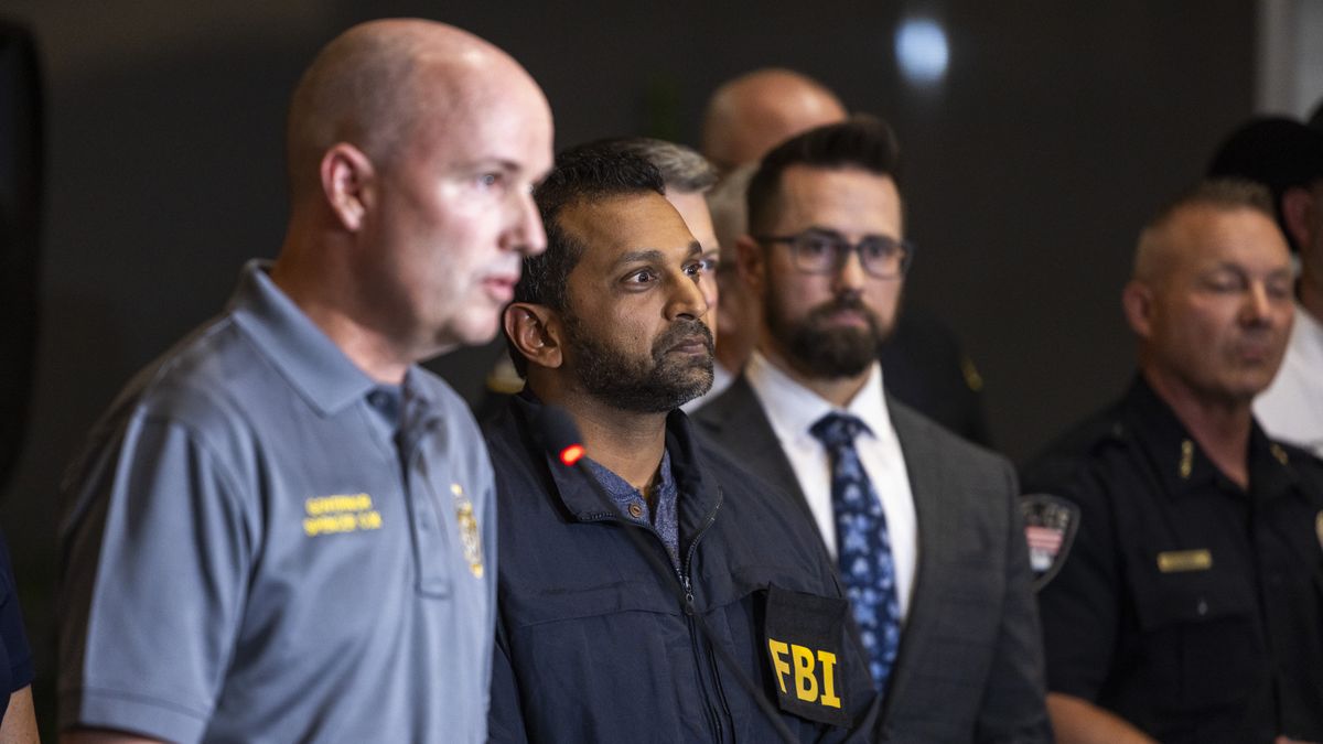 OREM, UTAH - SEPTEMBER 11: FBI director Kash Patel, right, listens as Governor of Utah Spencer Cox speaks during a press conference at Utah Valley University on September 11, 2025 in Orem, Utah. Authorities have released a "person of interest" as they search for the suspect who shot and killed Kirk, founder of Turning Point USA, while he was speaking at an event for his "American Comeback Tour". (Photo by Michael Ciaglo/Getty Images)