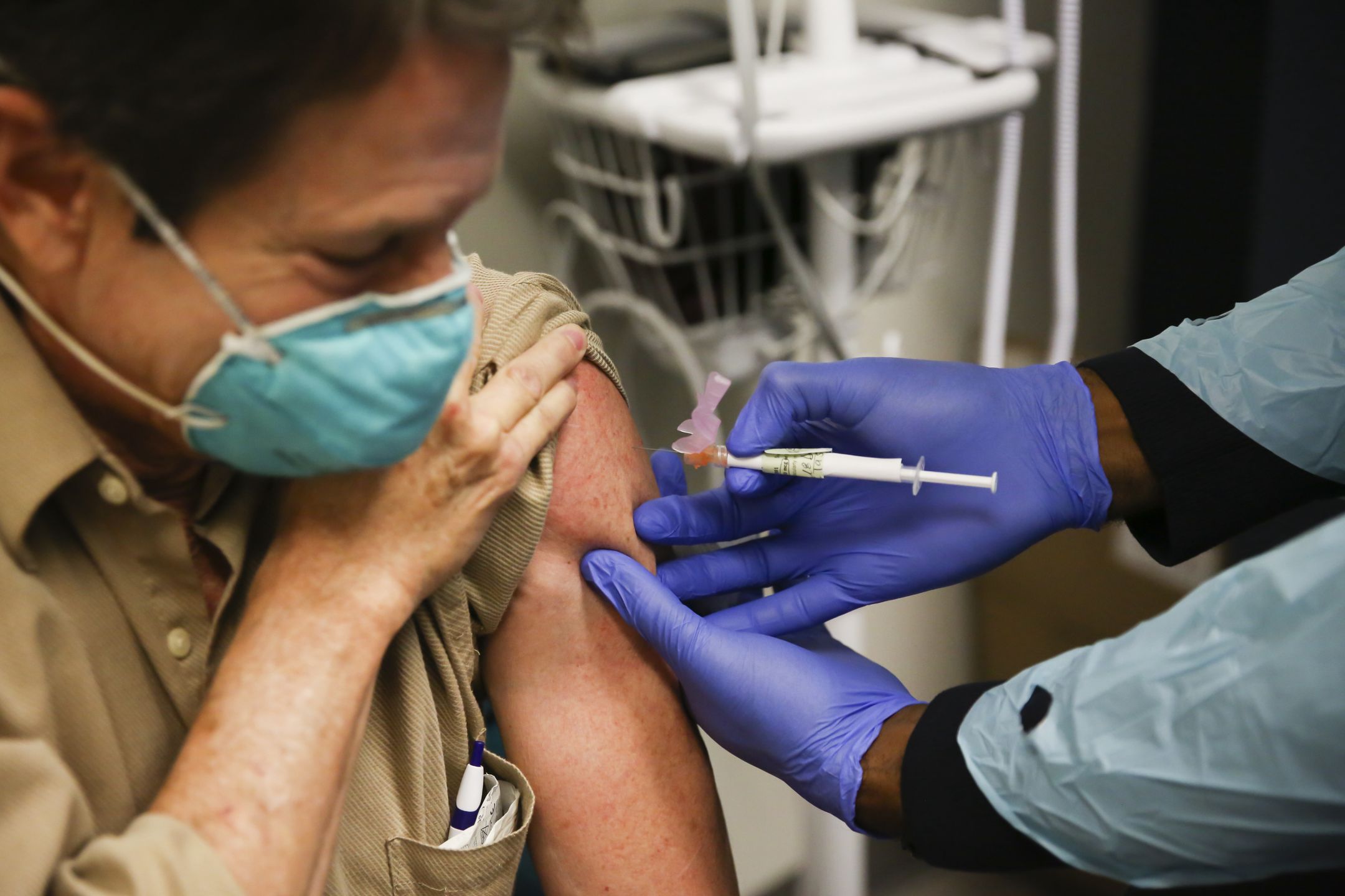 FLORIDA, USA - DECEMBER 18: Steve Brandwene, a healthcare worker, 64 years old, receives a Pfizer-BioNtech Covid-19 vaccine at Research Centers of America in Hollywood, Florida, United States on December 18, 2020. (Photo by Eva Marie Uzcategui Trinkl/Anadolu Agency via Getty Images)