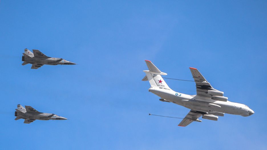 MOSCOW, RUSSIA - MAY 08, 2015: I
Two Russian Mikoyan MiG-31 (MIG 31 - NATO reporting name: Foxhound)
Interceptor aircraft and Ilyushin Il-80 (NATO reporting name: Maxdome) cargo plane fly over Moscow's Red Square during the general rehearsal for the Victory Day in Moscow (Photo by Artur Widak/NurPhoto via Getty Images)
