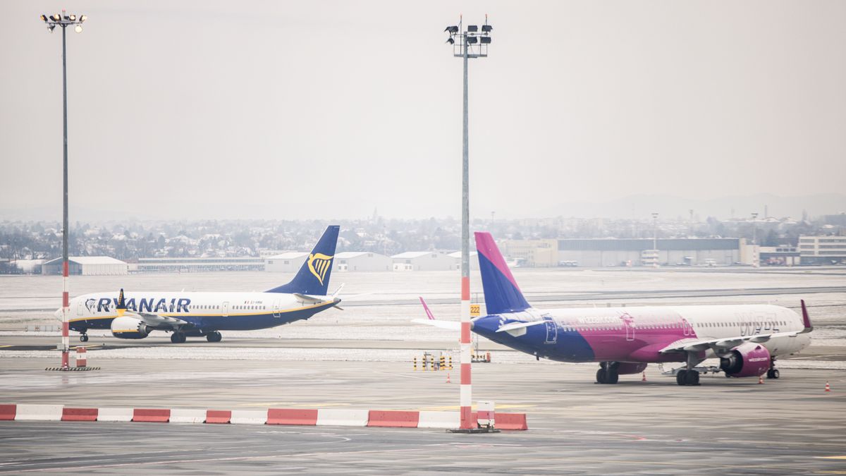 Passenger aircraft, operated by Ryanair Holdings Plc, left, and Wizz Air Holdings Plc, on the tarmac at Budapest Ferenc Liszt International Airport in Budapest, Hungary, on Monday, Jan. 8, 2024. Hungary is looking to attract the Qatar Investment Authority to a consortium the government is forming for the purchase of Budapest Airport. Photographer: Akos Stiller/Bloomberg via Getty Images