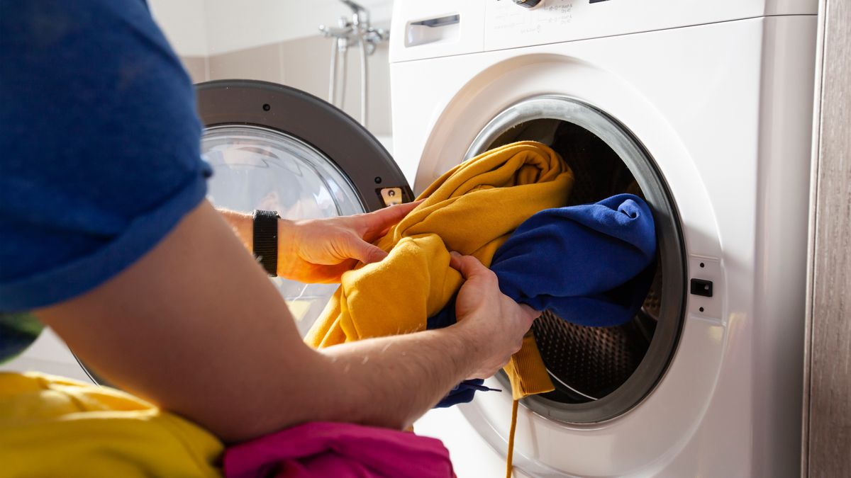 Man loading the washer dryer with clothes
different, color, instructions, filling, inside, loading, cleaning, holding, wash, launder, dilema, guy, floor, house, routine, appliance, man, machine, household, person, adult, laundry, washing, housework, equipment, dirty, clothes, caucasian, washer, hygiene, background, male, young, domestic, clean, dryer, bathroom, apparel, casual, textile, object, stained, housekeeping, homework, chores, putting, clothing, cotton, home