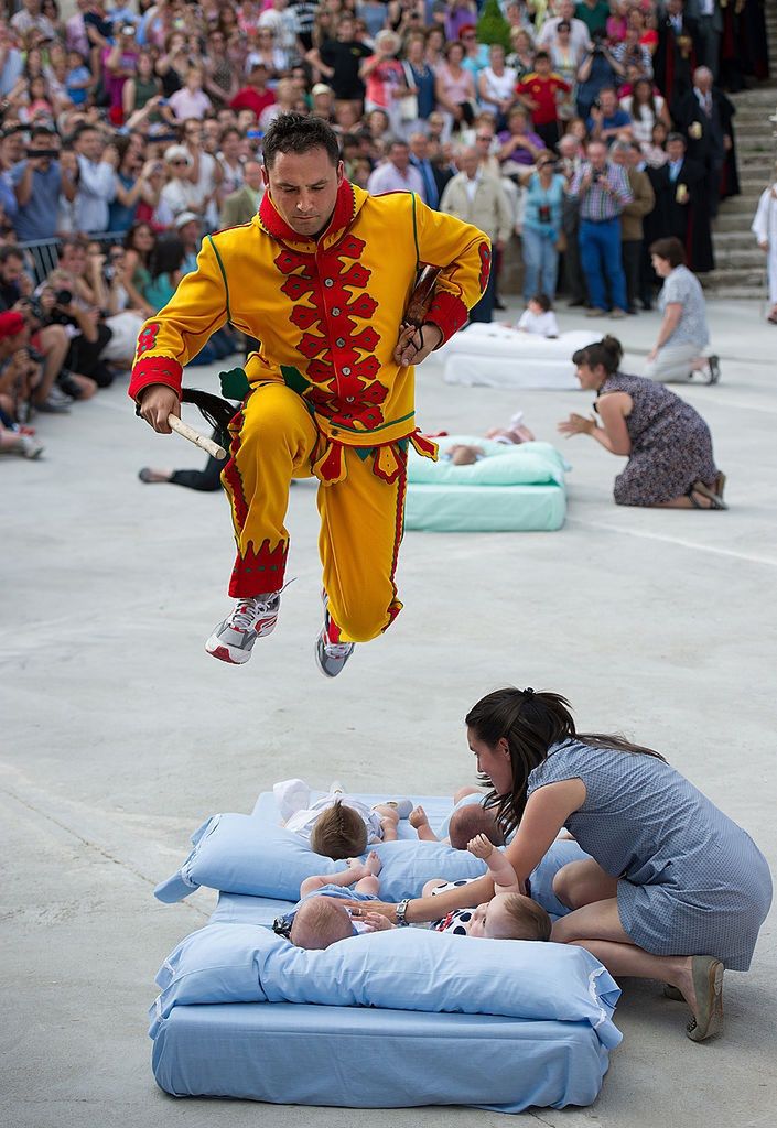 El Colacho Corpus Christi Celebrations
CASTRILLO DE MURCIA, SPAIN - JUNE 22:  A man representing the devil leaps over babies during the festival of El Salto del Colacho (the devil's jump) on June 22, 2014 in Castrillo de Murcia, Spain. The festival, held on the first Sunday after Corpus Cristi, is a catholic rite of the devil cleansing babies of original sin.  (Photo by Denis Doyle/Getty Images)
Denis Doyle
Human Interest, Religion, Spirituality