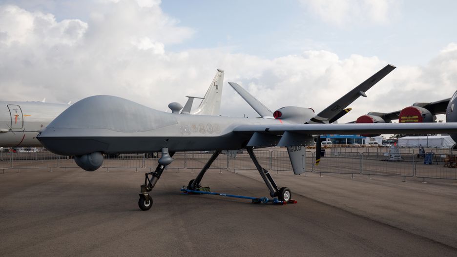 A U.S. Air Force MQ-9 Reaper unmanned aerial vehicle (UAV) drone, manufactured by General Atomics Aeronautical Systems Inc, stands on display during the Singapore Airshow at the Changi Exhibition Centre in Singapore, on Tuesday, Feb. 11, 2020. Planemakers and airlines are exploring new designs to reduce fuel burn and cut carbon emissions in a warming climate. Blending the wings with the fuselage to cut drag is one of several possible solutions. Photographer: SeongJoon Cho/Bloomberg via Getty Images