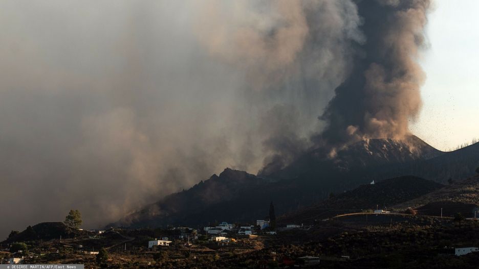 TemporaryThe Cumbre Vieja volcano is seen from Los Llanos de Aridane on the Canary island of La Palma in September 25, 2021. - La Palma airport, affected by the eruption of the Cumbre Vieja volcano, is inoperative due to the volcanic ash accumulation, AENA, the public body that manages Spanish airports, reported today. The Cumbre Vieja went on erupting on September 19, 2021 forcing the evacuation of more than 6,000 people and covering with lava more than 180 hectares (445 acres) of land. (Photo by DESIREE MARTIN / AFP)DESIREE MARTIN