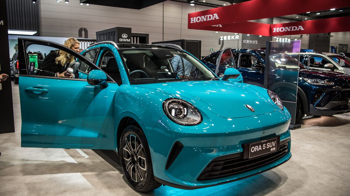 MELBOURNE, AUSTRALIA - 2026/04/10: Media representative seen exploring newly revealed GWM ORA 5 during media launch at the 2026 Melbourne Motor Show. (Photo by Alexander Bogatyrev/SOPA Images/LightRocket via Getty Images)