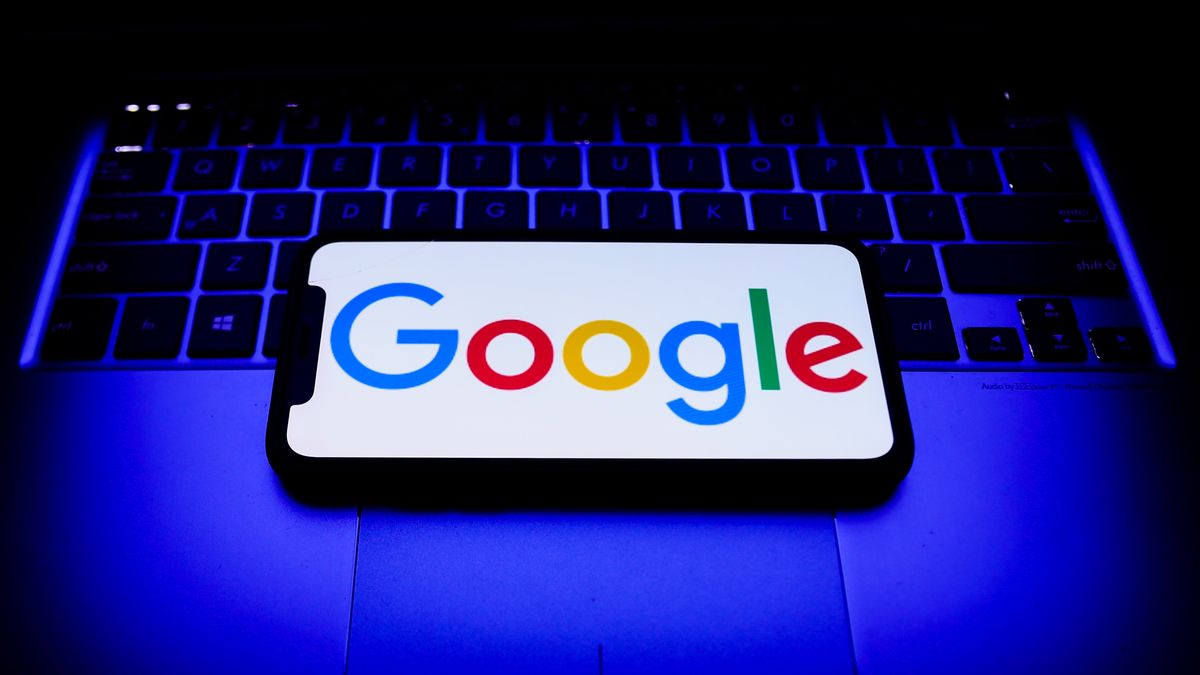 Google logo displayed on a phone screen and a laptop keyboard are seen in this illustration photo taken in Krakow, Poland on October 31, 2021. (Photo by Jakub Porzycki/NurPhoto via Getty Images)