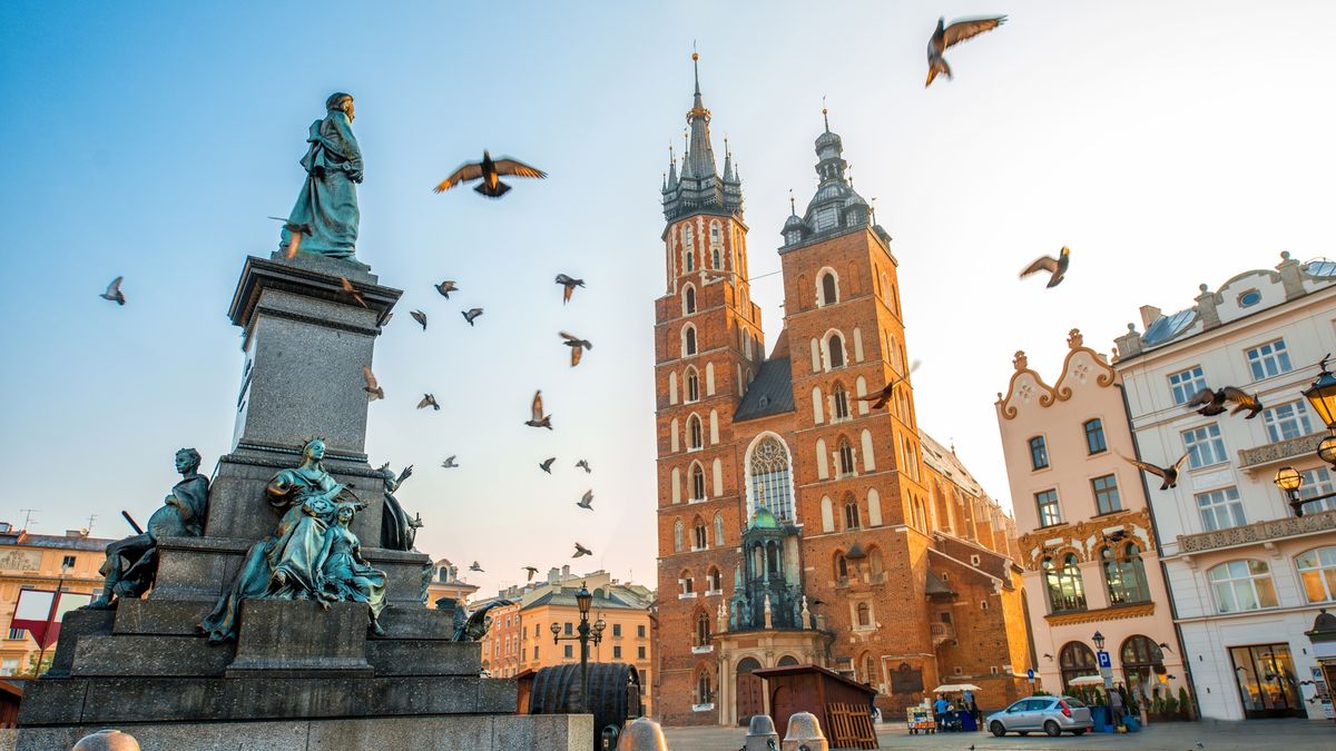 Old city center view in Krakow
Old city center view with Adam Mickiewicz monument, St. Mary's Basilica and birds flying in Krakow on the morning
RossHelen
Beautiful, Saint, Tourism, Morning, Building Exterior, Royalty, Poet, Mariacki, Krakow, Basilica, Statue, History, Ancient, Old, Famous Place, Architecture, Poland, Europe, Sunrise - Dawn, River Main - Germany, Corridor, Market, Cathedral, Church, Town Square, Monument, Tower, Cityscape, City, Town, marys, mickiewicz, City Of Center, Sunny