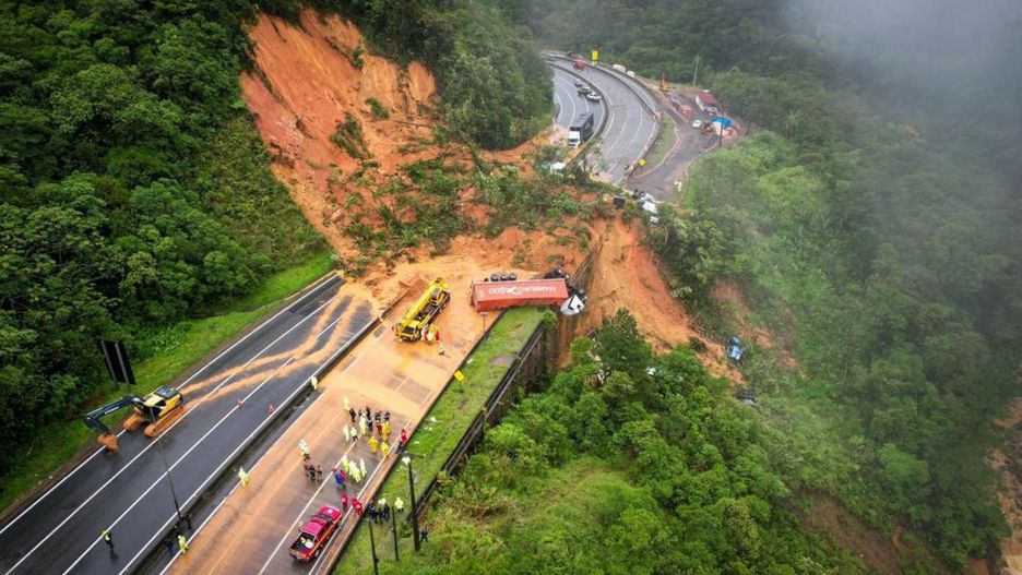 Temporary
This handout picture released by the Santa Catarina Fire Department shows the BR-367 highway blocked after a landslide in Guaratuba, Parana state, Brazil, on November 30, 2022. - Two people were found dead and at least 30 were missing in a landslide that swept away around 20 vehicles on a road in southern Brazil, firefighters estimated on Wednesday. (Photo by Santa Catarina Fire Department / AFP) / RESTRICTED TO EDITORIAL USE - MANDATORY CREDIT "AFP PHOTO / SANTA CATARINA FIRE DEPARTMENT" - NO MARKETING NO ADVERTISING CAMPAIGNS - DISTRIBUTED AS A SERVICE TO CLIENTS
-