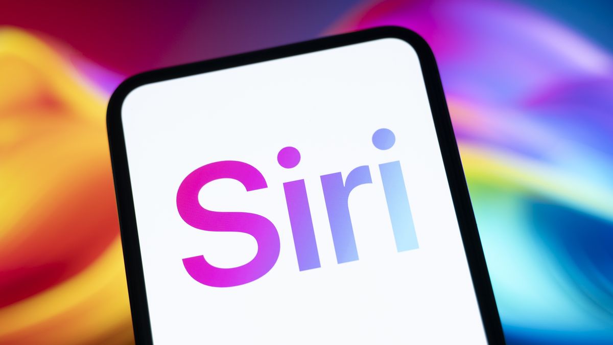 The Siri logo appears on a smartphone screen with a colorful abstract illustration in the background. Google and Apple enter into a collaboration agreement to integrate Gemini into Siri and the entire ecosystem in Creteil, France, on January 14, 2026. (Photo by Samuel Boivin/NurPhoto via Getty Images)