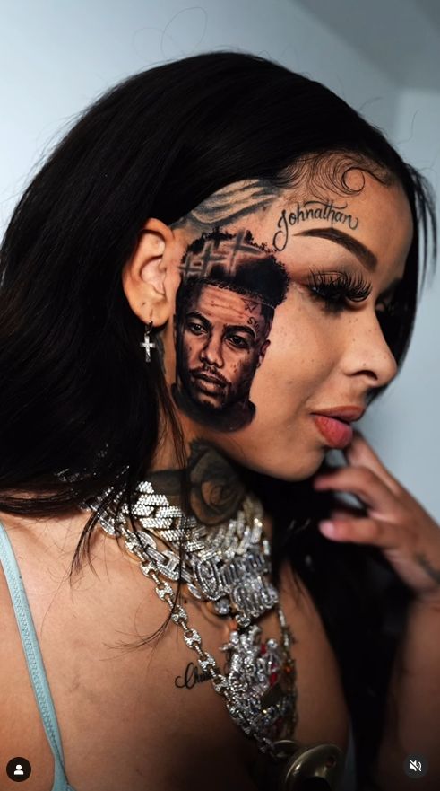 She tattooed her partner's face on her cheek.