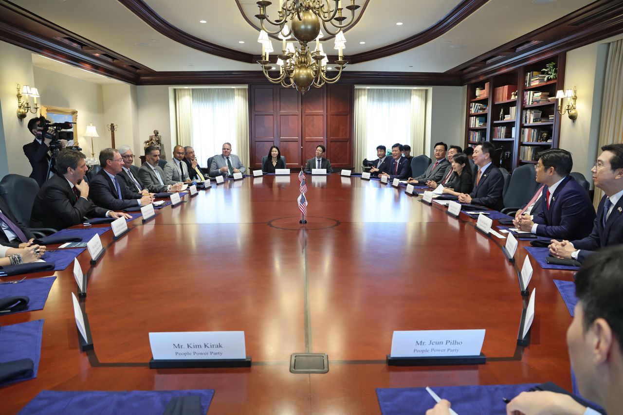 A handout photo made available by South Korea's ruling People Power Party shows a party delegation, led by its leader Kim Gi-hyeon (3-R), talking with US experts on the Korean Peninsula during a luncheon meeting hosted by the Heritage Foundation in Washington, DC, USA, 11 July 2023 (issued 12 July 2023).