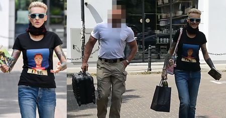 Agnieszka Chylińska w eskorcie ochroniarza niesie swoją książkę