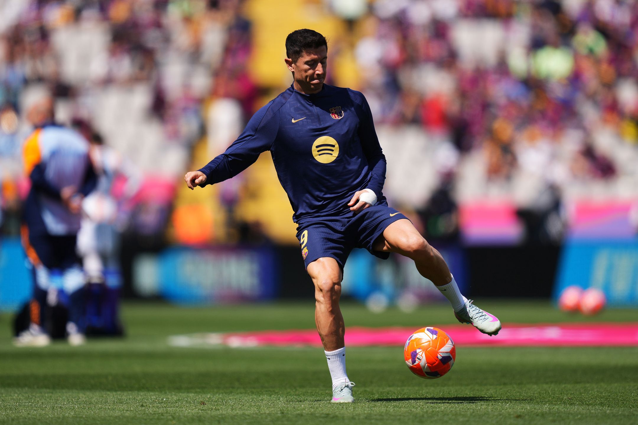 BARCELONA, SPAIN - MAY 11: Robert Lewandowski of FC Barcelona controls the ball during warm ups prior to the LaLiga match between FC Barcelona and Real Madrid CF at Estadi Olimpic Lluis Companys on May 11, 2025 in Barcelona, Spain. (Photo by Alex Caparros/Getty Images)