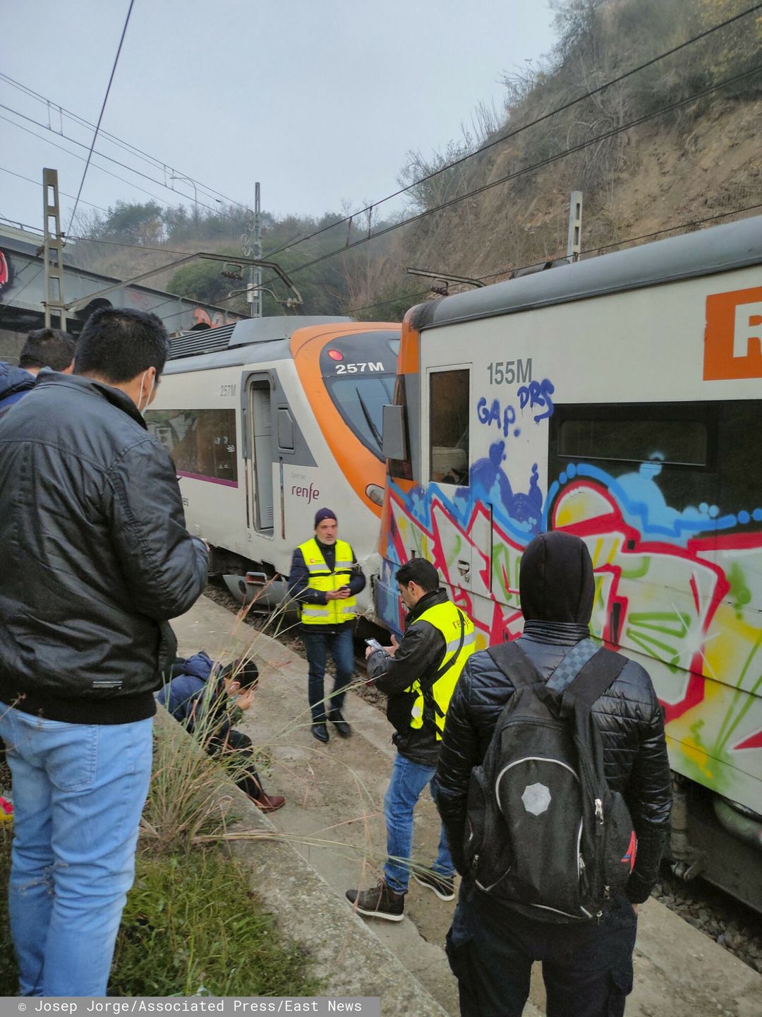Temporary
Passengers and railway staff are seen at the scene of a train collision in Montcada i Reixac, Spain, Wednesday Dec. 7, 2022. Spanish officials say two trains have collided near Barcelona and 155 people have been hurt. Emergency services for Catalonia said no passengers were seriously injured. The collision occurred on a train line in Montcada i Reixac, a town just north of Barcelona. (Josep Jorge via AP)
Josep Jorge