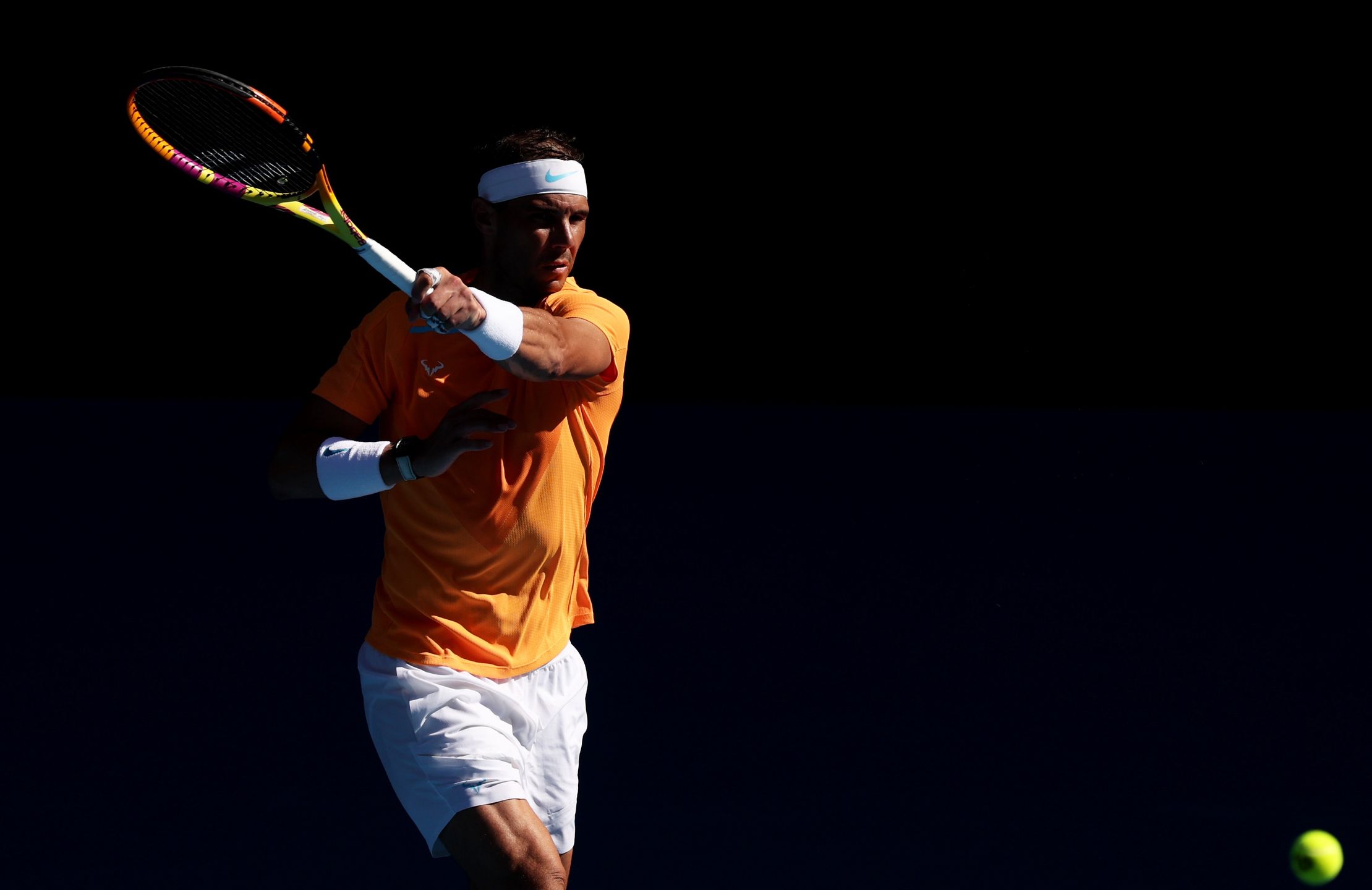 MELBOURNE, AUSTRALIA - JANUARY 16: Rafael Nadal of Spain plays a forehand in their round one singles match against Jack Draper of Great Britain during day one of the 2023 Australian Open at Melbourne Park on January 16, 2023 in Melbourne, Australia. . (Photo by Clive Brunskill/Getty Images)
