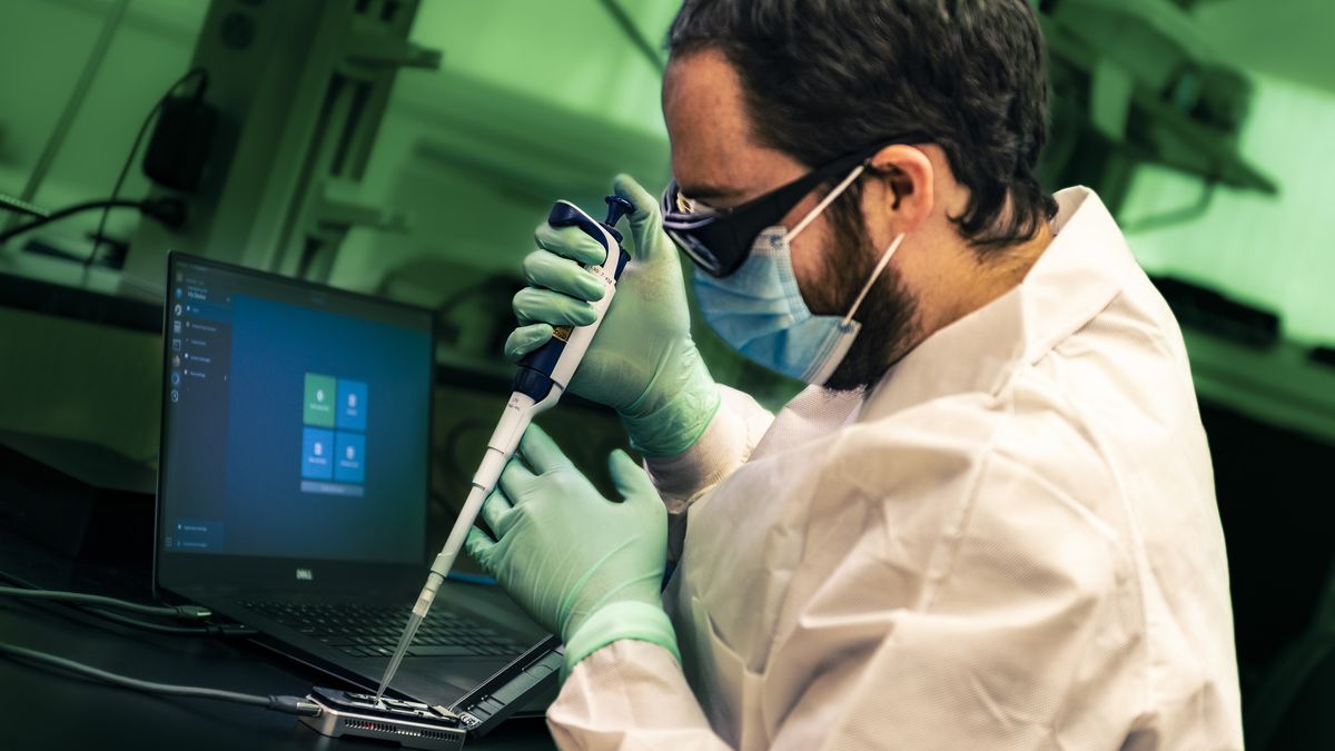 A public health scientist from the CDC Enteric Diseases Laboratory Branch prepares a portable sequencing instrument for whole genome sequencing, 2021. WGS provides detailed genetic information about pathogens that make people sick. Image courtesy CDC. (Photo by Smith Collection/Gado/Getty Images)