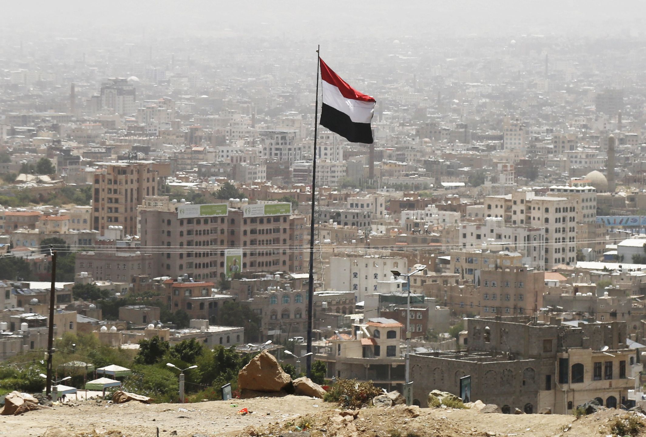 SANA'A, YEMEN - MAY 14: Yemen's National flag is waving over the capital Sana'a on May 14, 2025 in Sana'a, Yemen. Tensions remain high in the region as Yemen's Iran-backed Houthi rebels and Israel continue to exchange attacks. The Houthis have said they will continue their attacks on Israel in solidarity with Palestinians under Israeli bombardment and aid blockade in Gaza. Meanwhile, US President Donald Trump announced earlier this month that the US would stop bombing the Houthis, in exchange for the group halting its attacks on US vessels in the Red Sea. (Photo by Mohammed Hamoud/Getty Images)