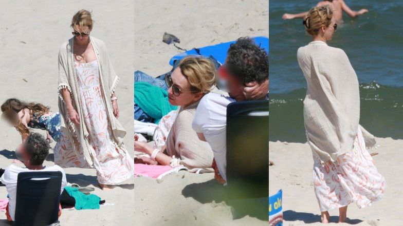 Anna Kalczyńska pije piwo na plaży i fotografuje pociechy