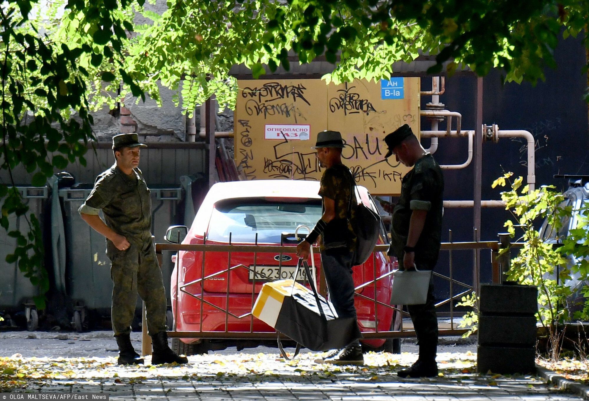 Temporary
Russian servicemen talk to each other in a yard in Southern Russian city of Rostov-on-Don on September 7, 2023, prior to Russia's local elections. Prigozhin, good or bad? In Russia, war or no war? In Rostov-on-Don, the short-lived capital of the Wagner group during its mutiny, the paradoxes and unrest within the Russian population are increased tenfold. On the flip side: everything is normal, as the Kremlin assures us. This weekend, local elections are planned in this large city located near the Ukrainian border and logistics center of the Russian army. (Photo by Olga MALTSEVA / AFP)
OLGA MALTSEVA