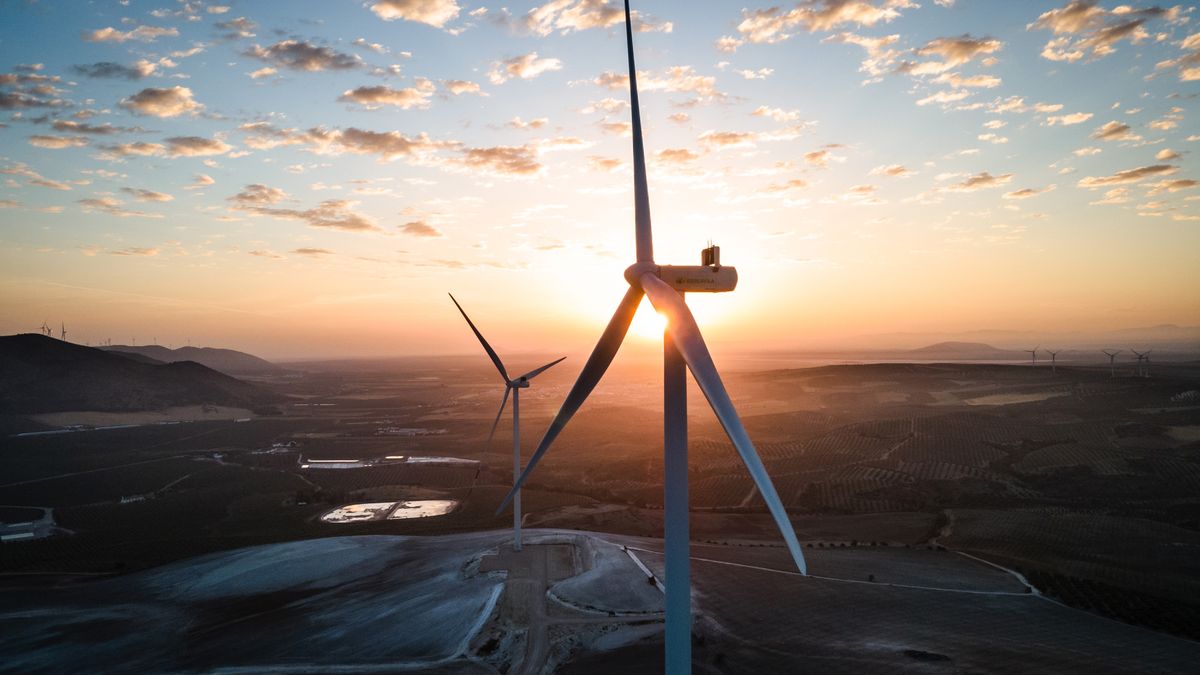 Wind turbines at the Martin de la Jara wind farm, operated by Iberdrola SA, during sunrise in the Martin de la Jara district of Sevilla, Spain, on Friday, April 21, 2023. In November, Spain's biggest utility Iberdrola said it would allocate 27 billion over the next three years to power grids, expanding and strengthening capacity as more renewable energy flows into the system and industries electrify. Photographer: Angel Garcia/Bloomberg via Getty Images