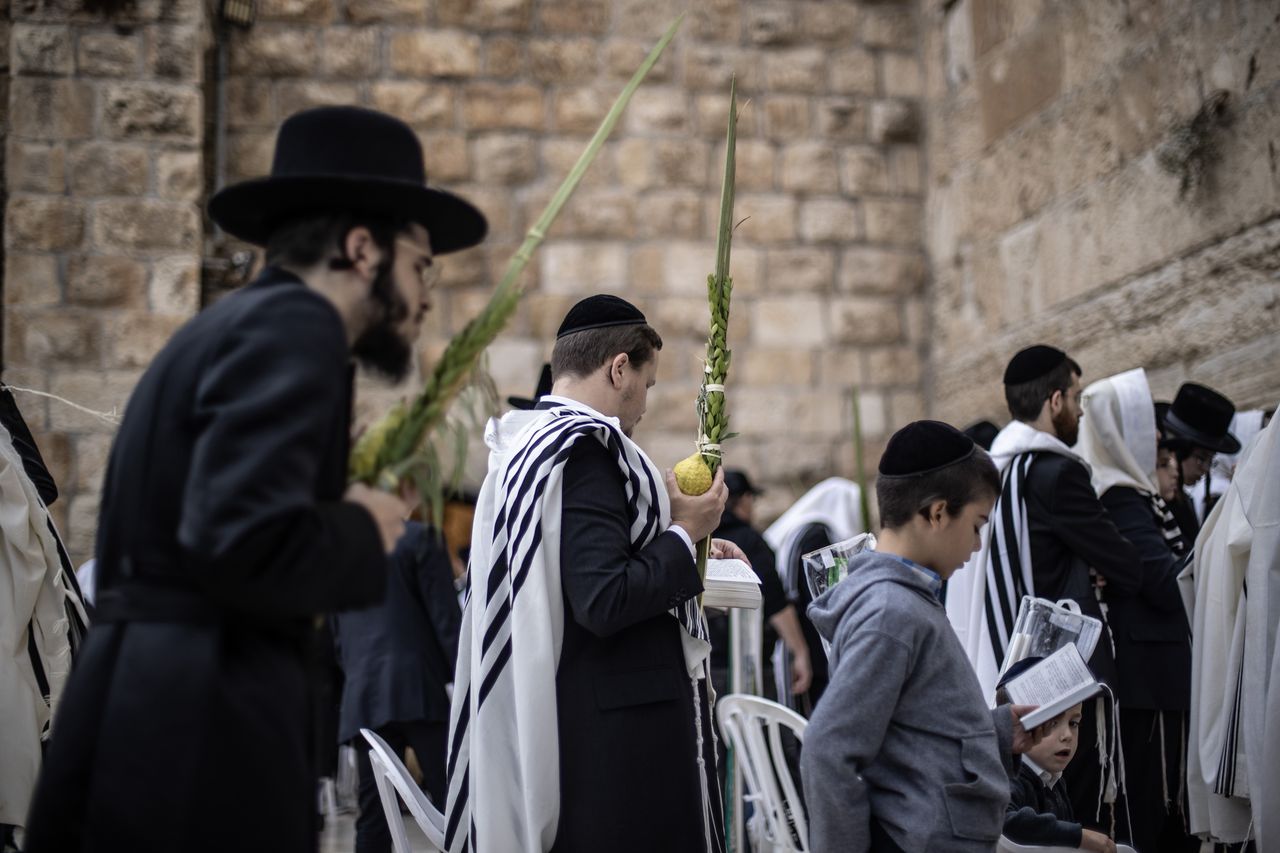 Jews pray at the Wailing Wall.