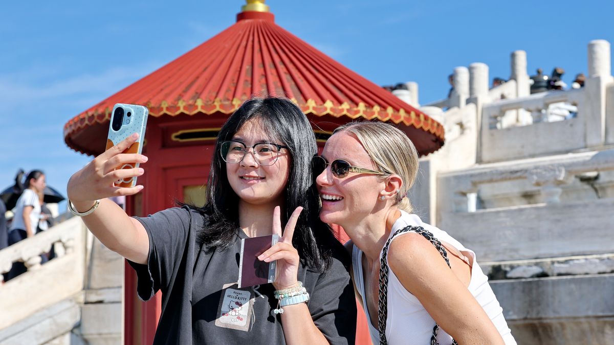 BEIJING, CHINA - AUGUST 17: Tourists visit the Temple of Heaven Park under strong sunlight on August 17, 2026 in Beijing, China. Temperatures rose in the city with intense ultraviolet radiation, prompting visitors to wear sun hats and protective clothing. (Photo by Wang Xin/VCG via Getty Images)