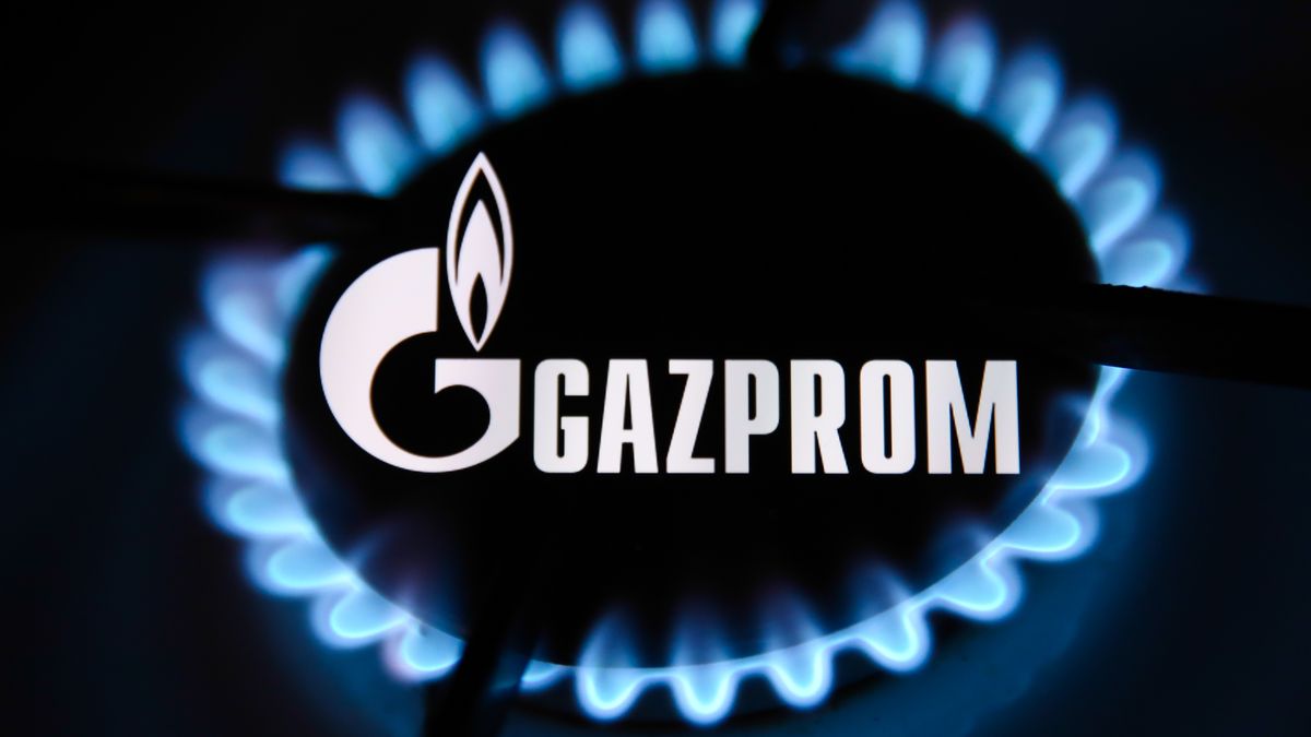 Gazprom logo displayed on a phone screen and flames from a gas burner are seen in this multiple exposure illustration photo taken in Krakow, Poland on October 11, 2021. (Photo by Jakub Porzycki/NurPhoto via Getty Images)