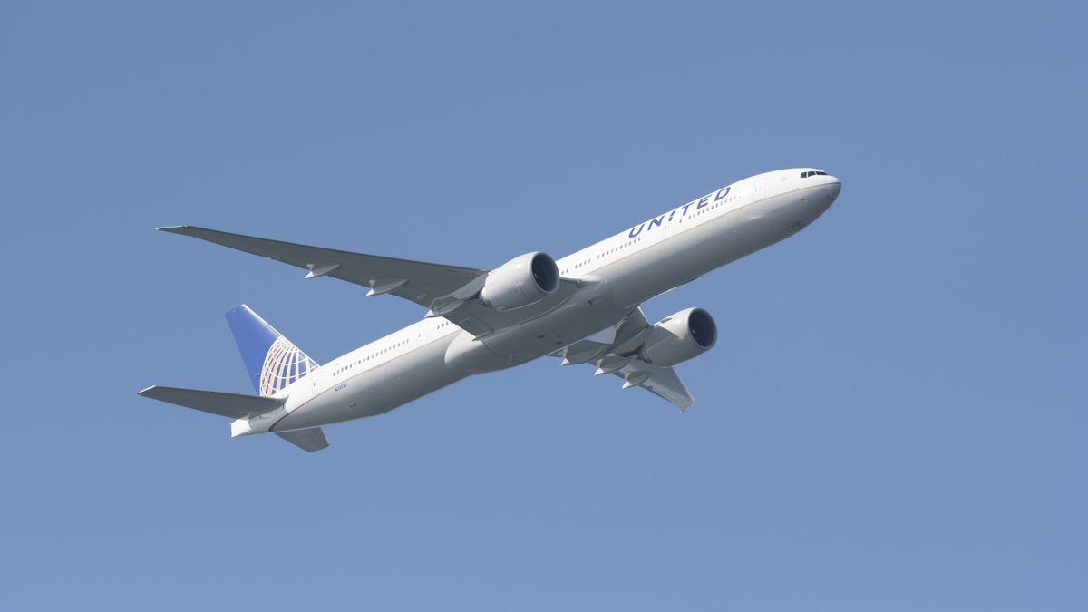 A United Airlines Boeing 777-300ER flies over the Golden Gate Bridge during Fleet Week 2019 in San Francisco, California on October 11, 2019. United Airlines will hold a conference call to discuss third-quarter 2019 financial results on Wednesday, October 16. (Photo by Yichuan Cao/NurPhoto via Getty Images)