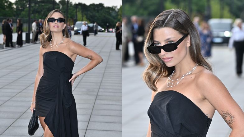 Julia Wieniawa w czarnej sukni i okularach maszeruje na event