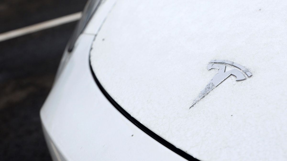Frost on the badge of a Tesla Model Y electric vehicle in a lot at the Tesla Inc. Gigafactory in Gruenheide, Germany, on Saturday, Jan. 21, 2023. Tesla CEO Elon Musk played down how much impact his tweets have on the company's stock price as he defended himself at a trial in San Francisco federal court on Friday over his 2018 tweet about taking the electric car-maker private. Photographer: Liesa Johannssen/Bloomberg via Getty Images