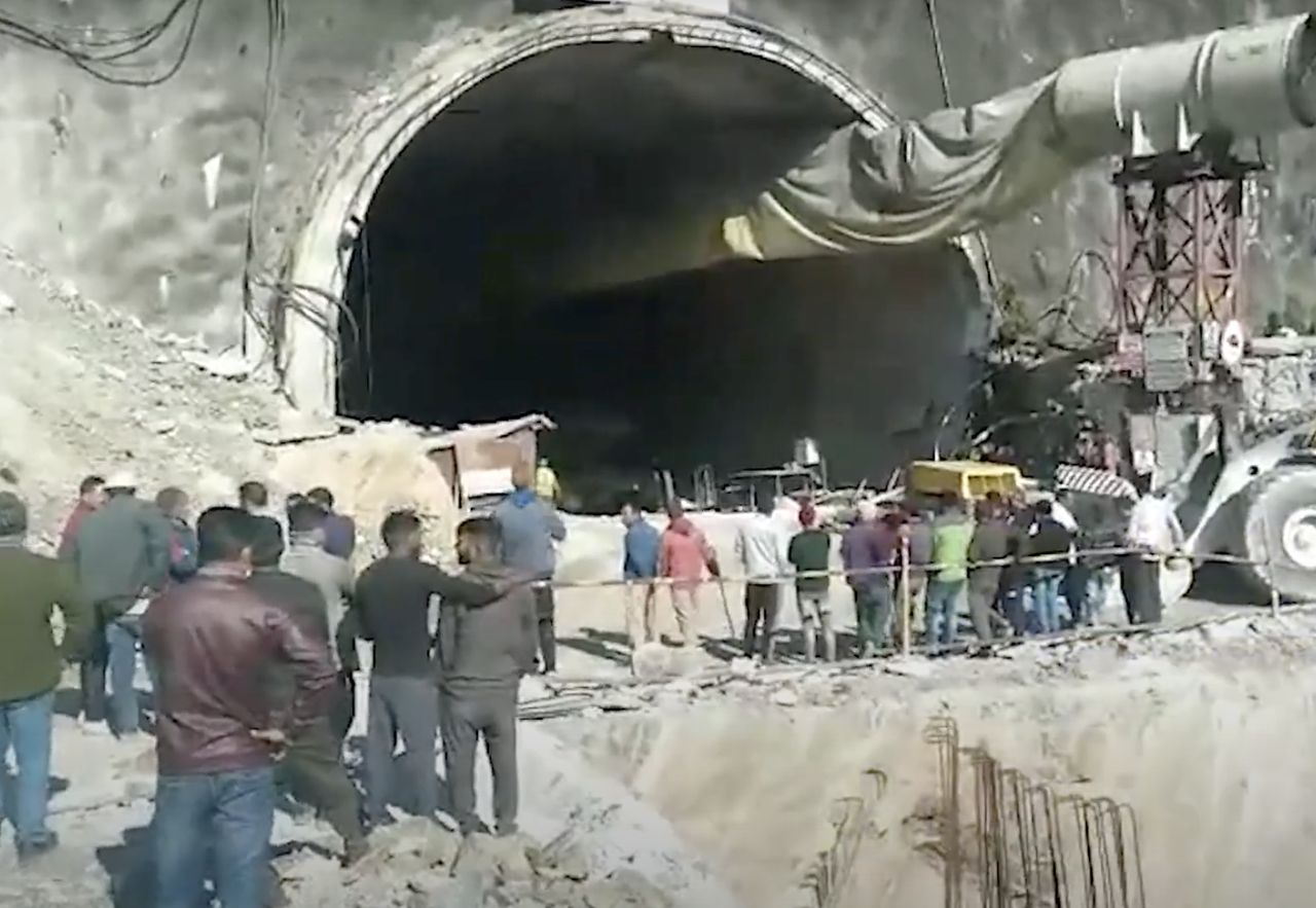 Rescuers are trying to extract 40 Indian road workers from a collapsed tunnel.