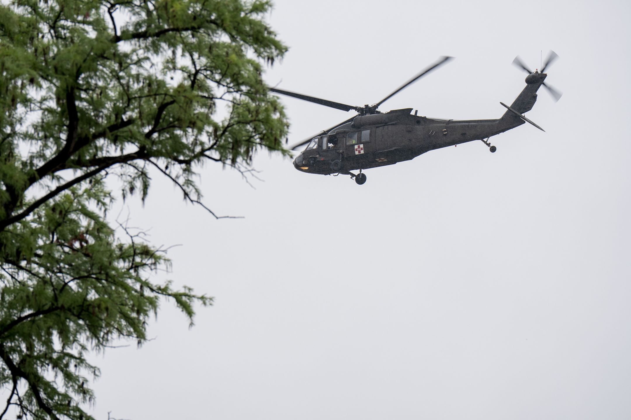 KERRVILLE, TEXAS - JULY 04: A UH-60 Black Hawk helicopter conducts rescue operations along the Guadalupe River on July 4, 2025 in Kerrville, Texas. Heavy rainfall caused flooding along the Guadalupe River in central Texas with multiple fatalities reported. (Photo by Eric Vryn/Getty Images)