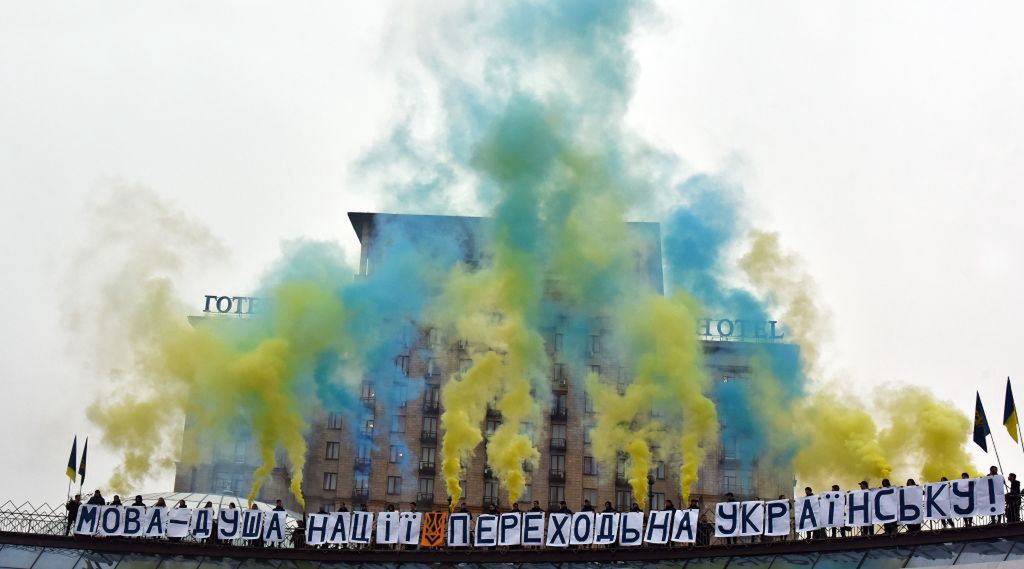 KYIV, UKRAINE  NOVEMBER 9, 2019 - Participants of the action dedicated to the Day of Ukrainian Writing and Language holdKYIV, UKRAINE  NOVEMBER 9, 2019 - Participants of the action dedicated to the Day of Ukrainian Writing and Language hold placards which make up a statement: "Language is the soul of the nation" below the clouds of color smoke billowing through the air at Maidan Nezalezhnosti, Kyiv, capital of Ukraine- PHOTOGRAPH BY Ukrinform / Future Publishing (Photo credit should read Ukrinform/Future Publishing via Getty Images)Future Publishingkyiv, day of ukrainian writing and language, action, popularization, ukrainian language